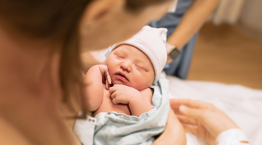 a person holding a newborn baby