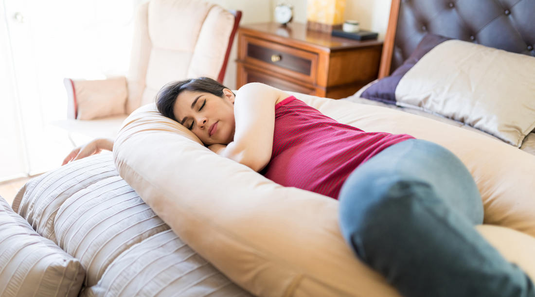 a person sleeping on a bed with a pillow